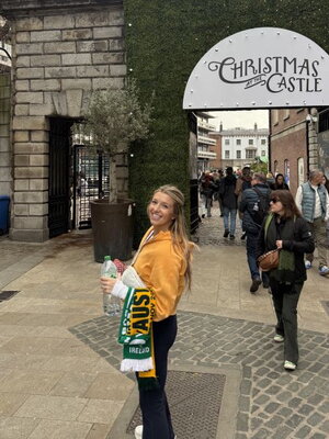 Image of Hailey in front of the Christmas Castle entrance